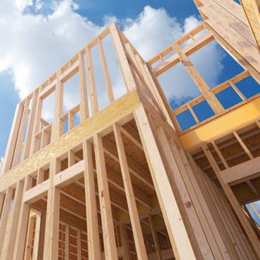 Assembling a frame house on the construction site. 3d illustration